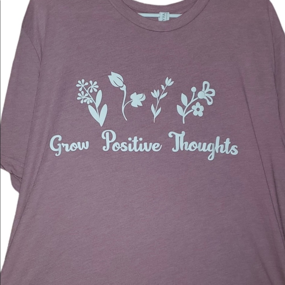 Grow Positive thoughts tee shirt available in a light pink or black.